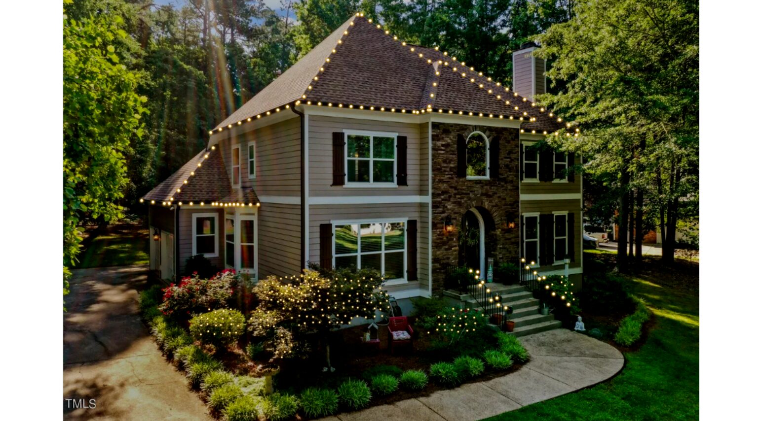 Home with permanent warm-white outdoor lighting and landscape lighting